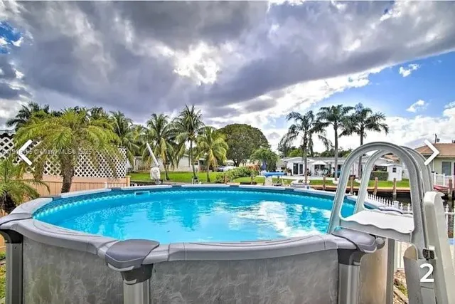 a view of swimming pool with a yard