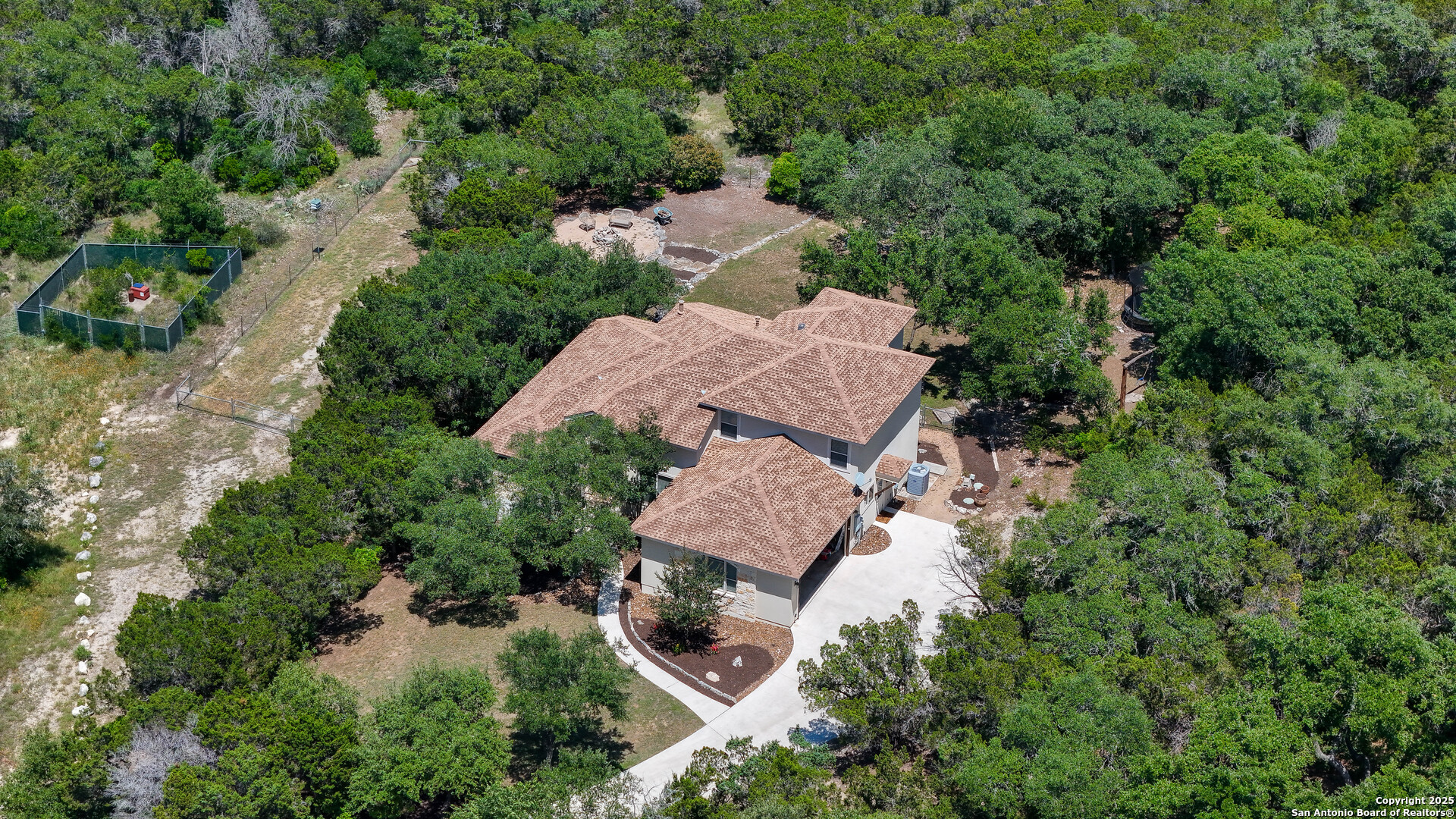 an aerial view of a house with yard and outdoor space