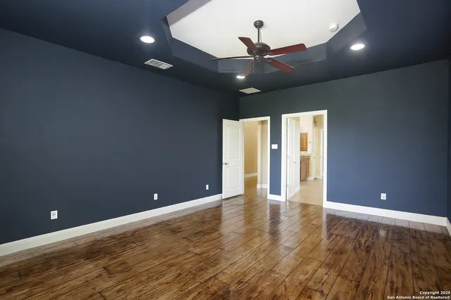 a large bathroom with a glass shower sink and mirror