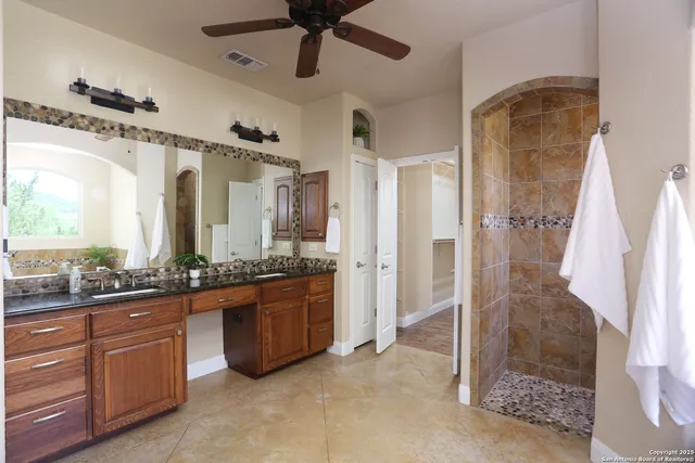 a bathroom with a bathtub and shower