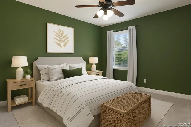 a bathroom with a granite countertop toilet and sink