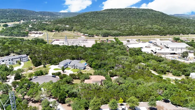 an aerial view of residential house with outdoor space and swimming pool