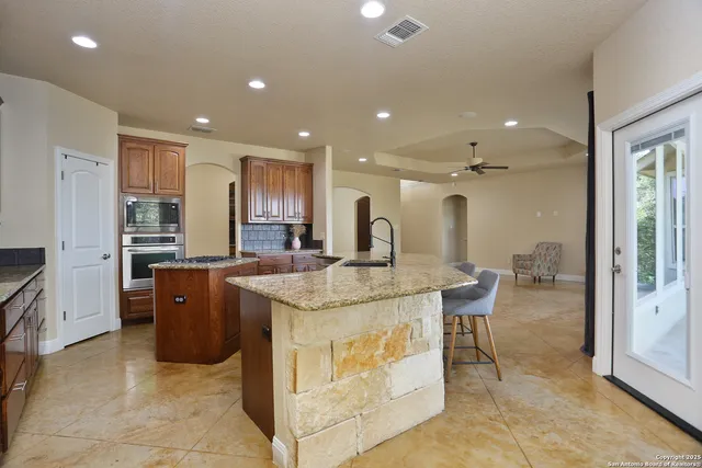 a kitchen with stainless steel appliances granite countertop counter top space cabinets and a counter top space