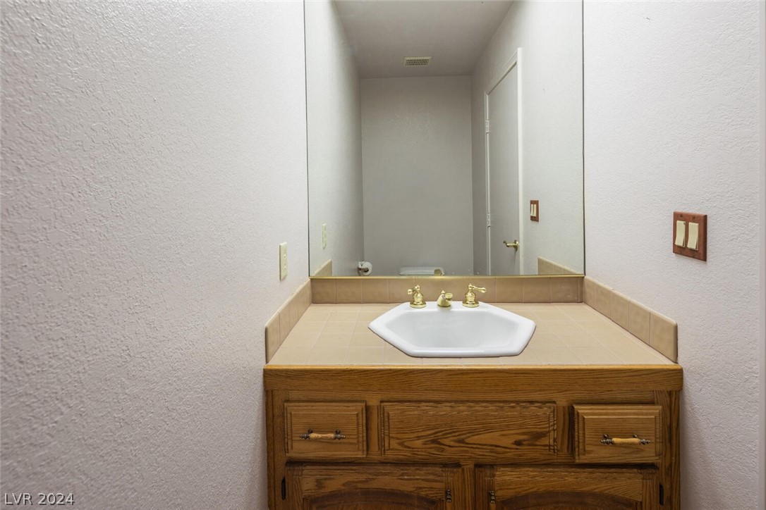 101 Quail Run Road Henderson, NV 89014 - Photo 44 of 53 1/2 pool bath has exterior access only from pool a