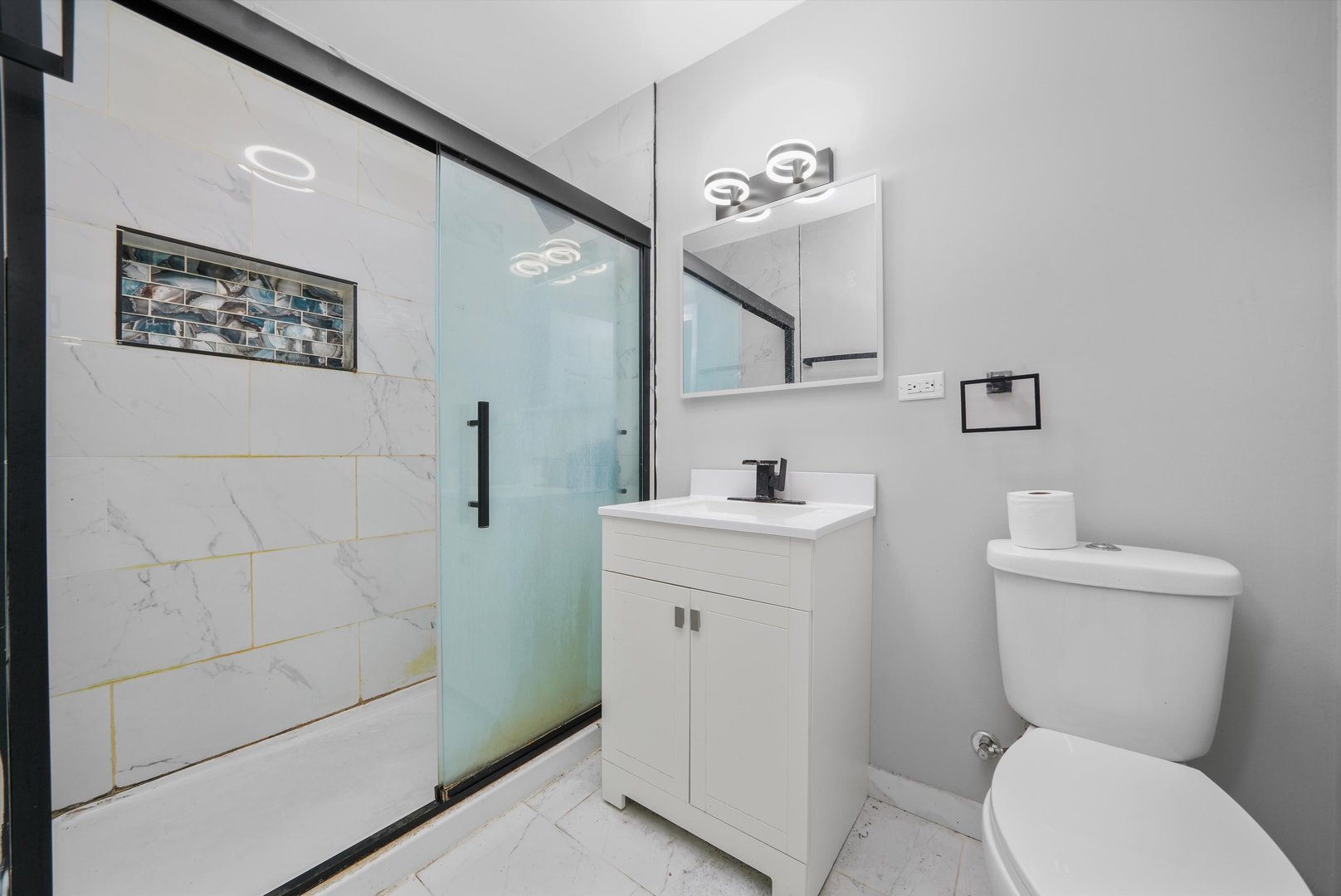 1011 East 142nd Street Dolton, IL 60419 - Photo 11 of 21 a bathroom with a toilet sink and mirror