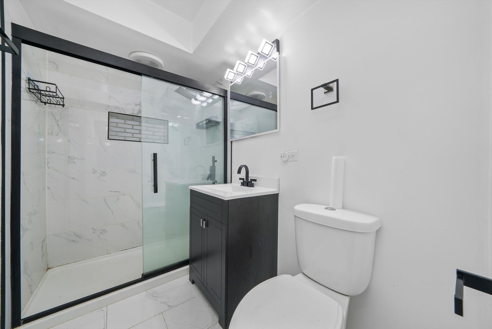 1011 East 142nd Street Dolton, IL 60419 - Photo 12 of 21 a white toilet sitting next to a bathroom sink