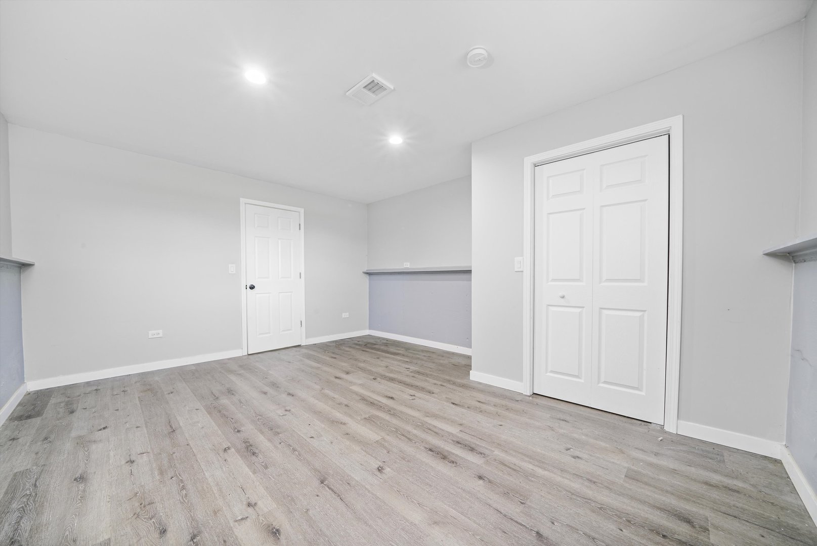 1011 East 142nd Street Dolton, IL 60419 - Photo 14 of 21 a view of an empty room with wooden floor and closet