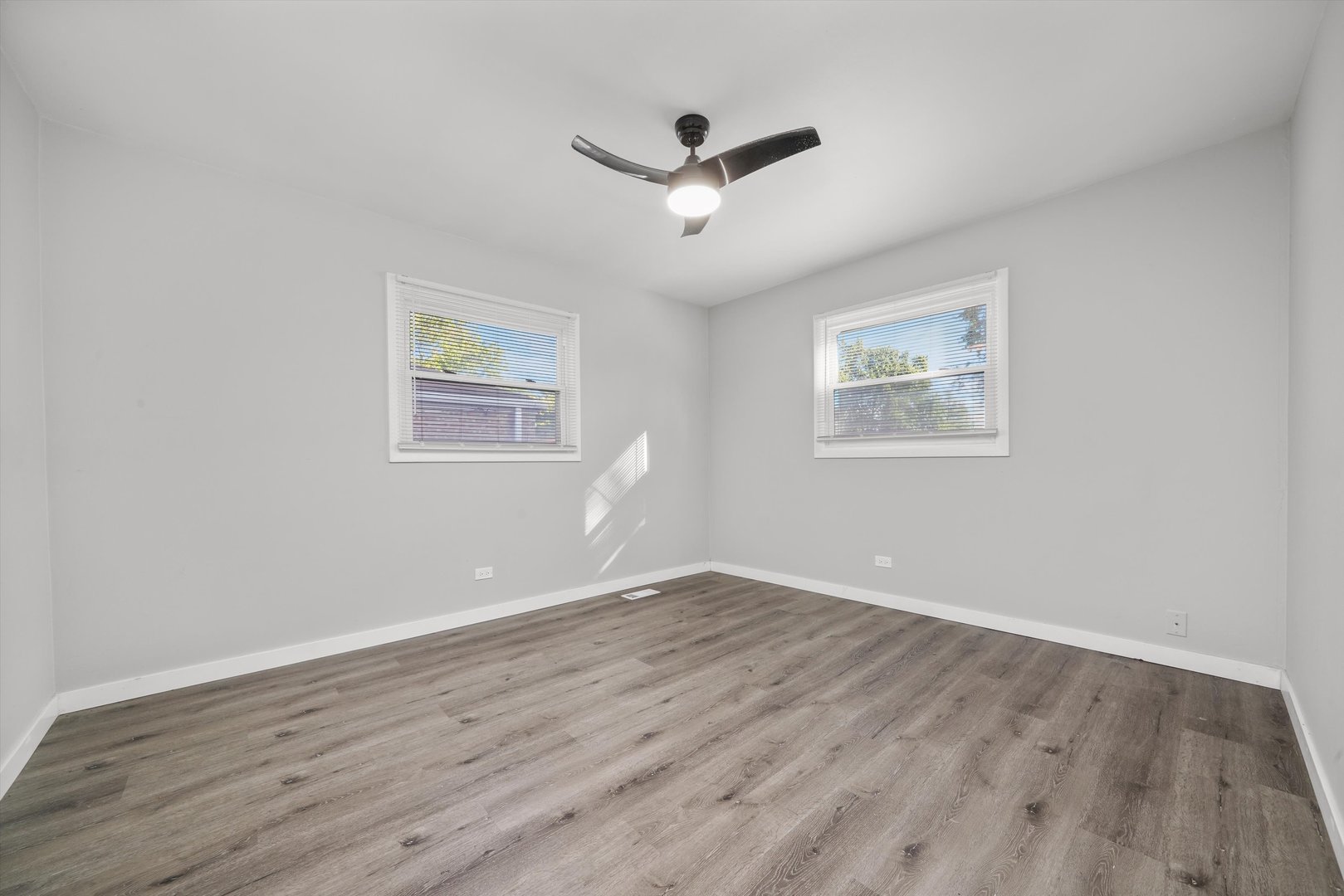 1011 East 142nd Street Dolton, IL 60419 - Photo 17 of 21 wooden floor in an empty room with a window