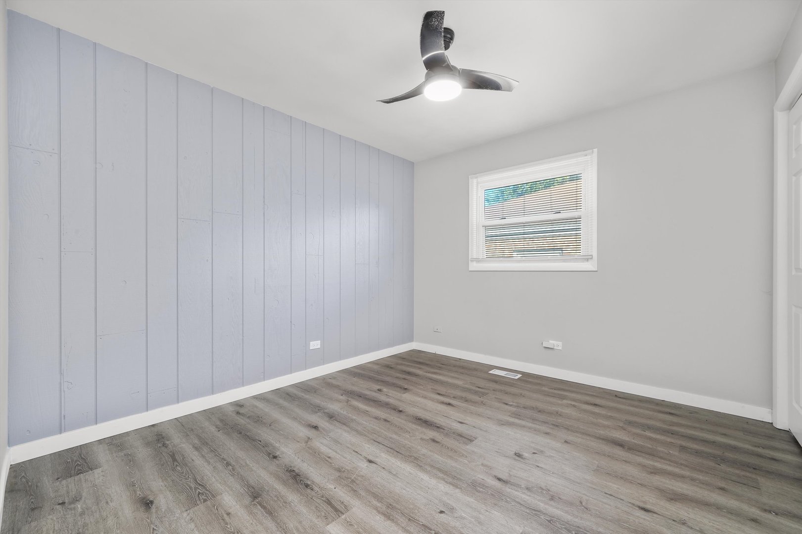1011 East 142nd Street Dolton, IL 60419 - Photo 18 of 21 a view of room with hardwood floor and ceiling fan