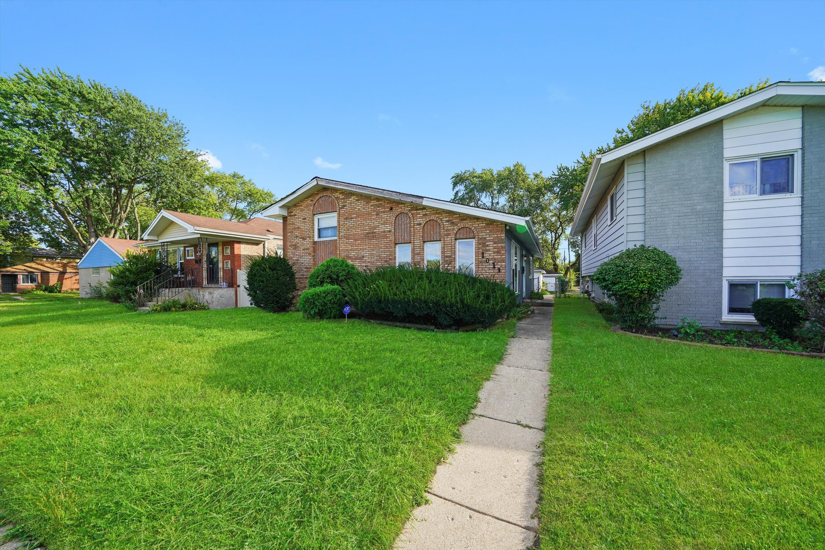 1011 East 142nd Street Dolton, IL 60419 - Photo 2 of 21 a view of a house with a yard