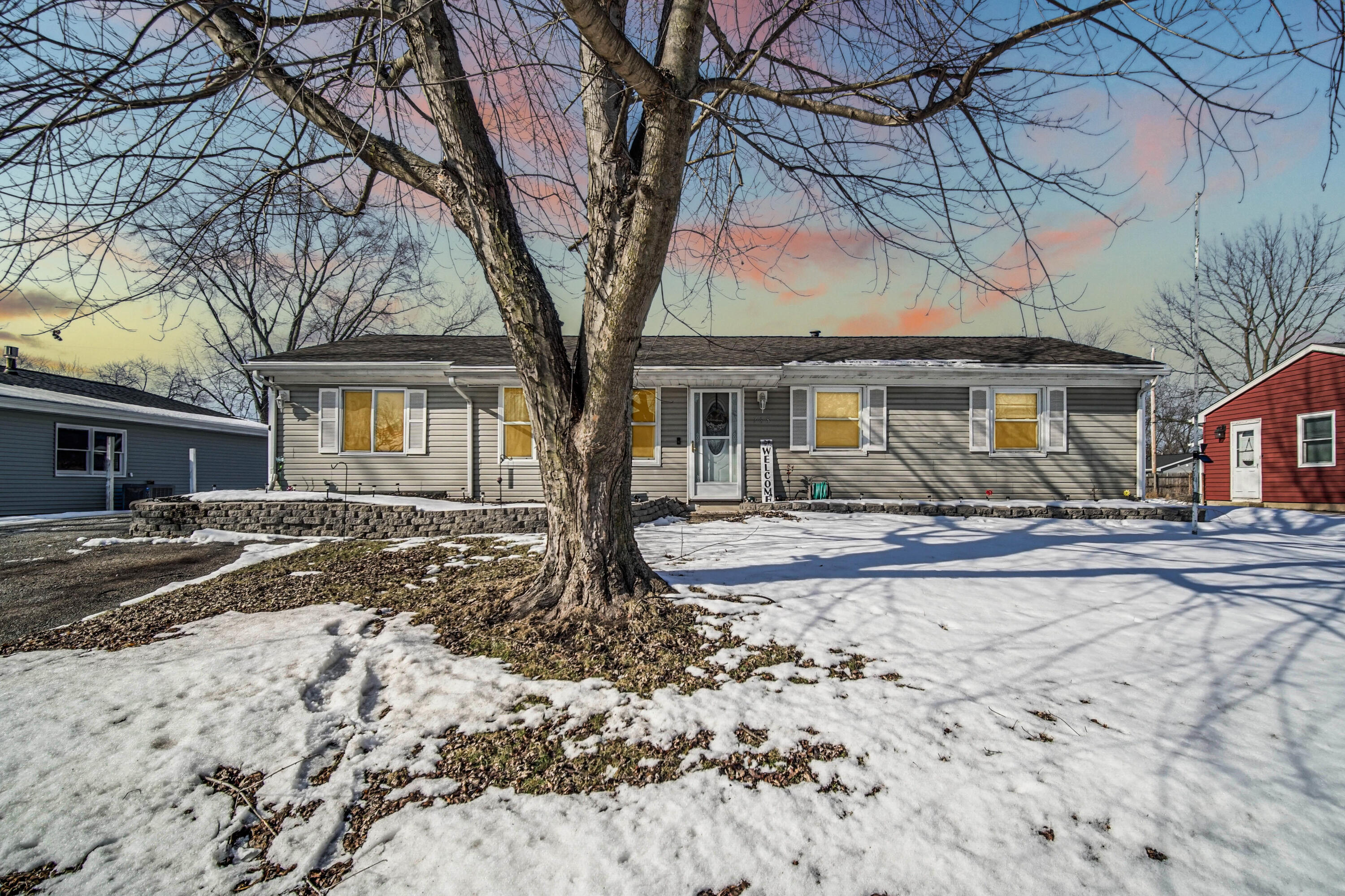 a front view of a house with garden