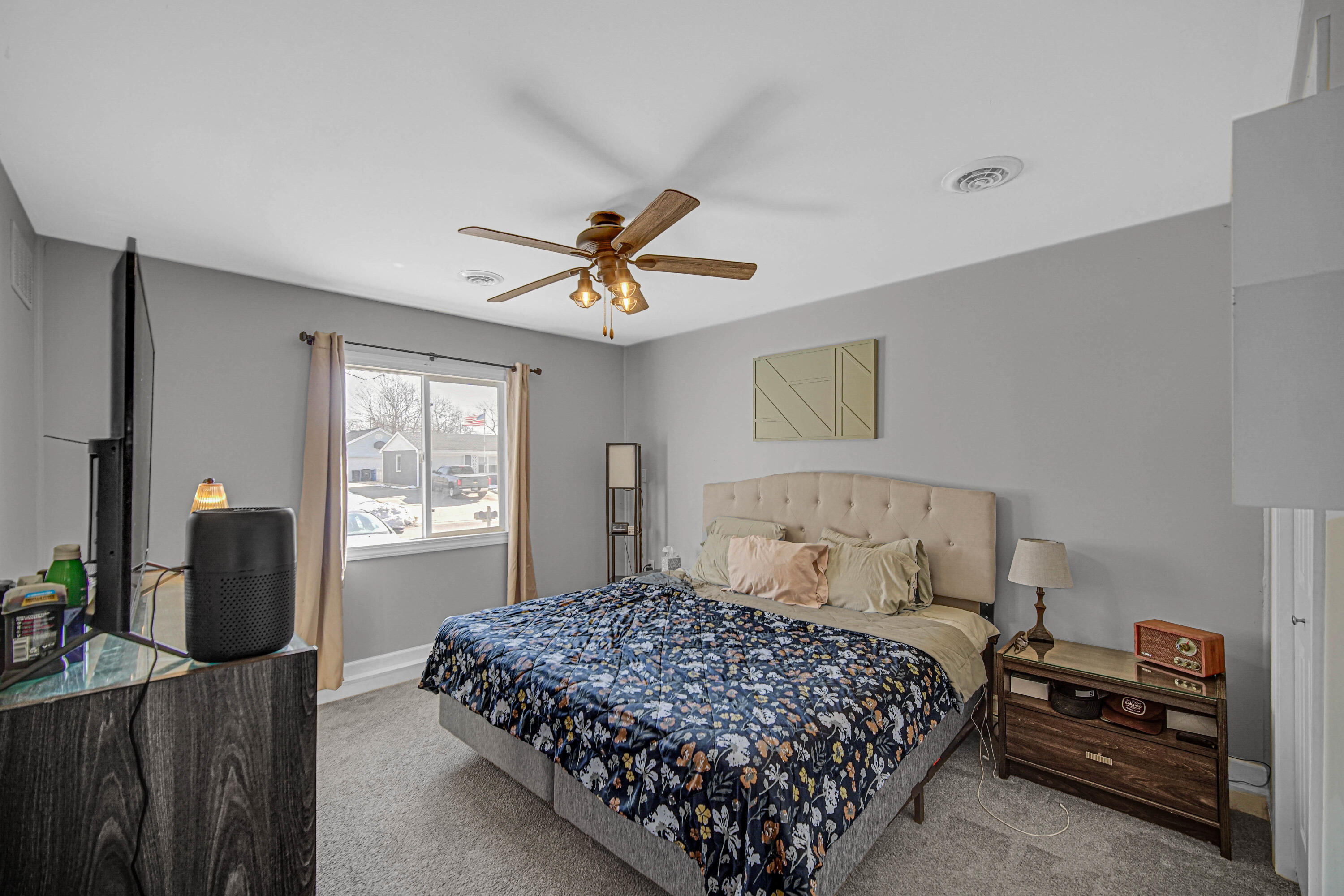 768 Devonshire Road Valparaiso, IN 46385 - Photo 11 of 23 a bedroom with a bed a computer on the desk and a dresser next to a window