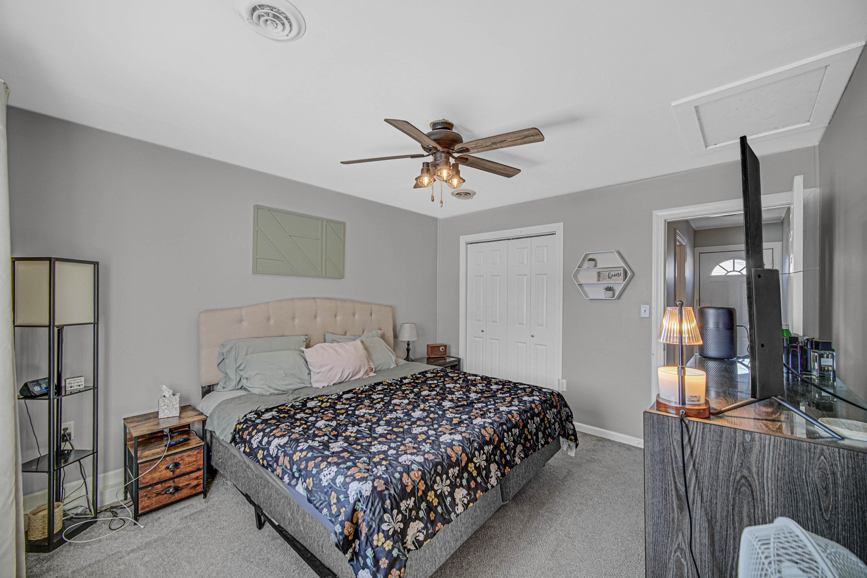 768 Devonshire Road Valparaiso, IN 46385 - Photo 12 of 23 a bedroom with a large bed and a chandelier