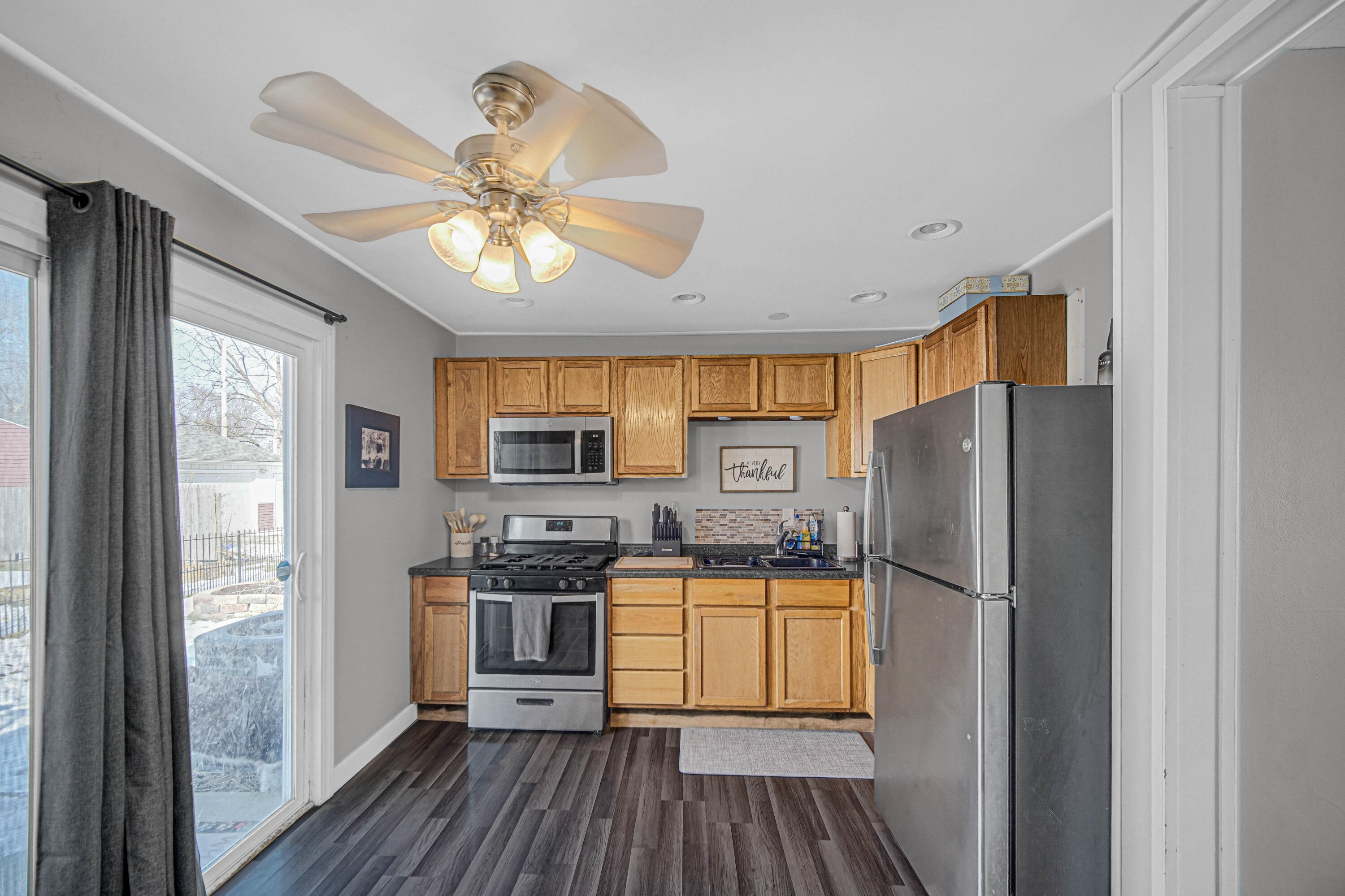 768 Devonshire Road Valparaiso, IN 46385 - Photo 14 of 23 a kitchen with stainless steel appliances a refrigerator and a stove top oven