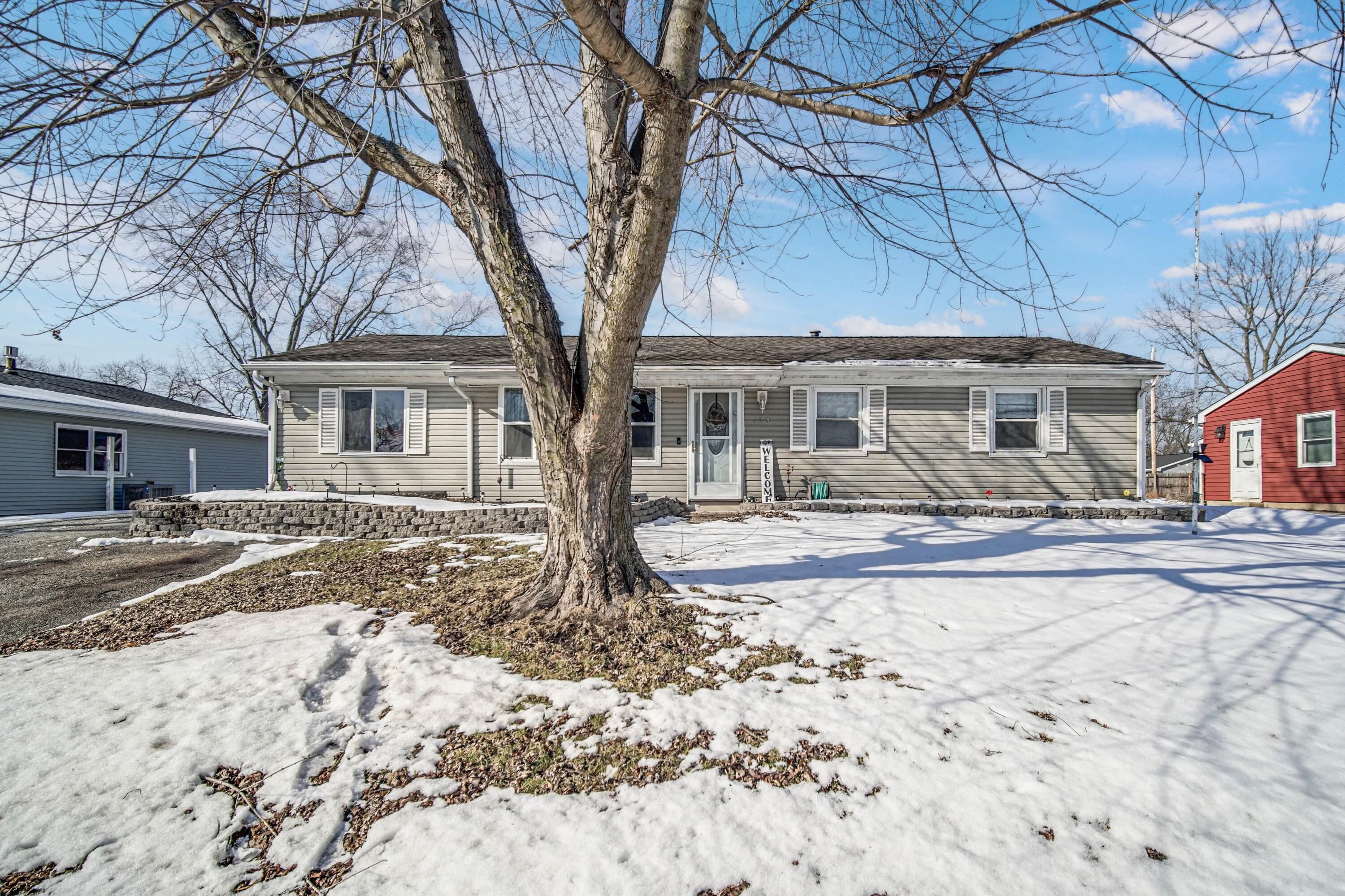 768 Devonshire Road Valparaiso, IN 46385 - Photo 21 of 23 a front view of a house with a yard covered in snow