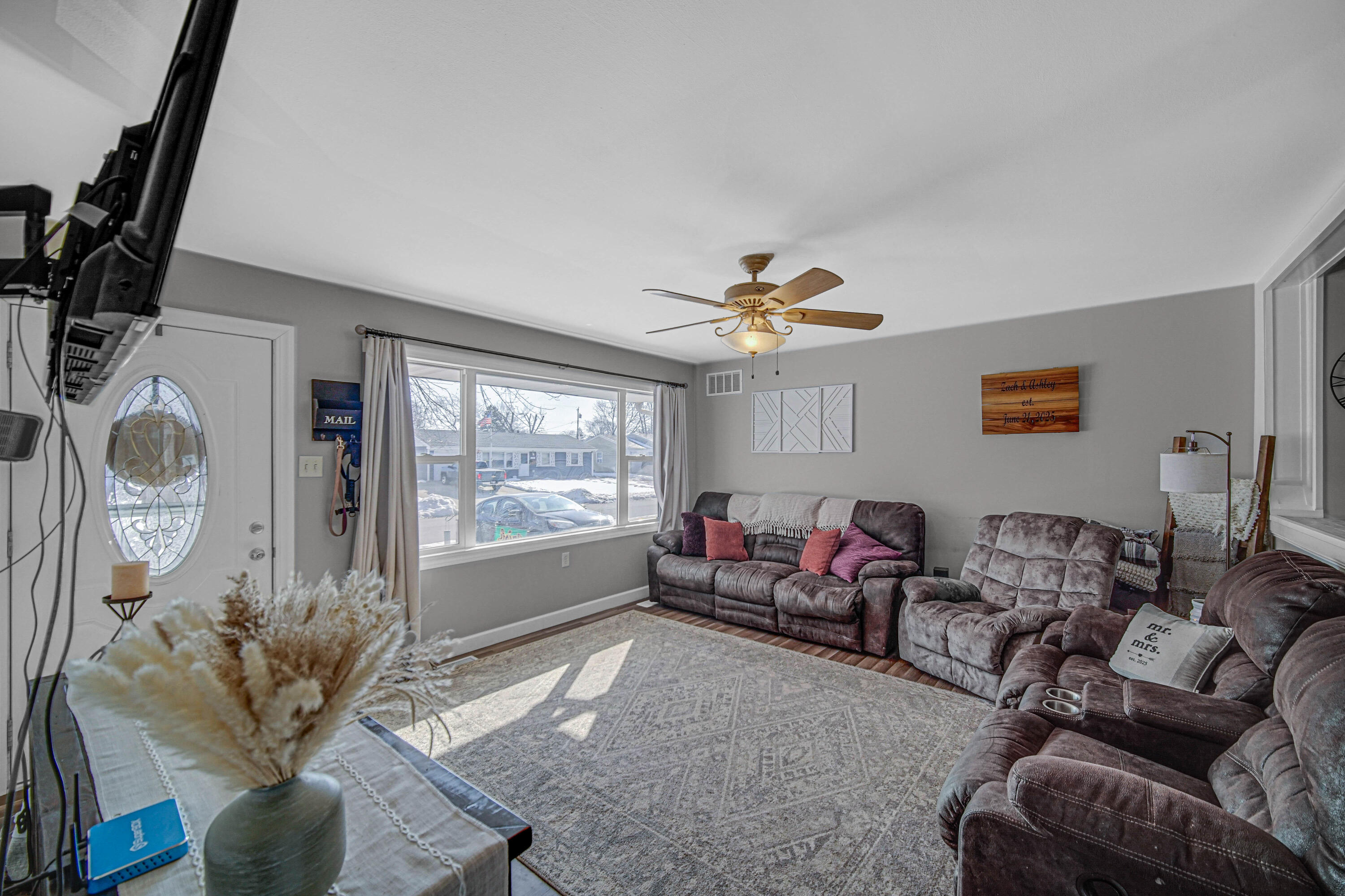 768 Devonshire Road Valparaiso, IN 46385 - Photo 5 of 23 a living room with furniture and a large window