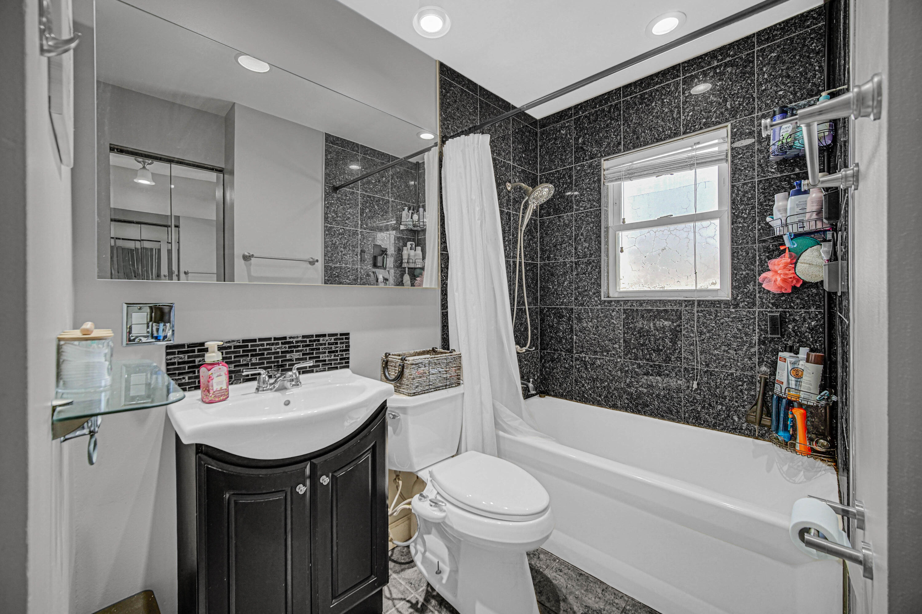 768 Devonshire Road Valparaiso, IN 46385 - Photo 8 of 23 a bathroom with a sink toilet and shower