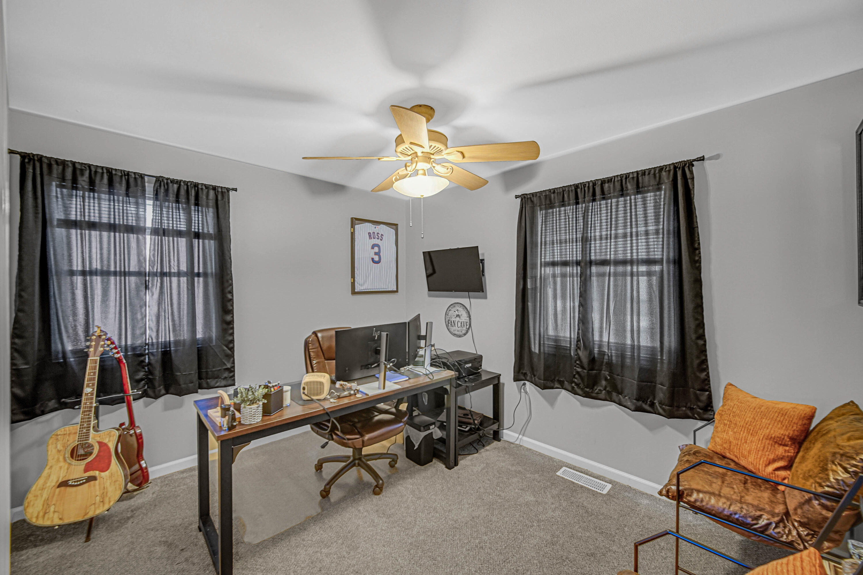 768 Devonshire Road Valparaiso, IN 46385 - Photo 9 of 23 a living room with furniture a lamp and a window