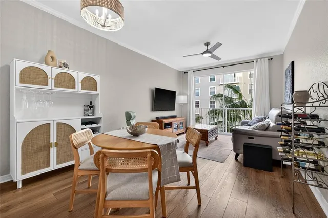 a view of a dining room with furniture window and wooden floor