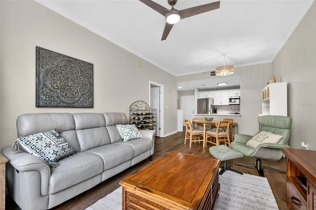a living room with furniture a rug and a table