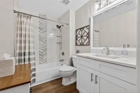 a bathroom with a sink a toilet and a bathtub