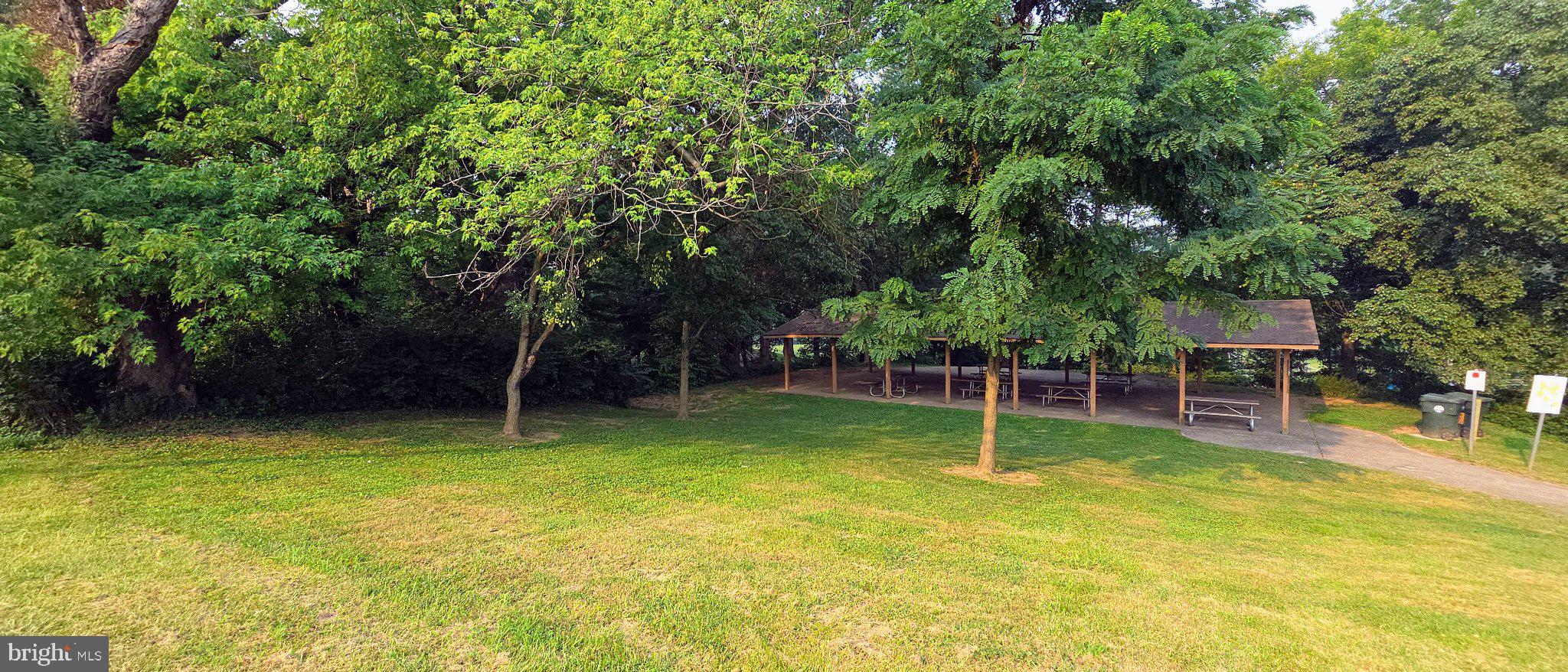 506 Pickwick Village Way Silver Spring, MD 20901 - Photo 19 of 31 Lush greenery surrounds a serene pavilion.