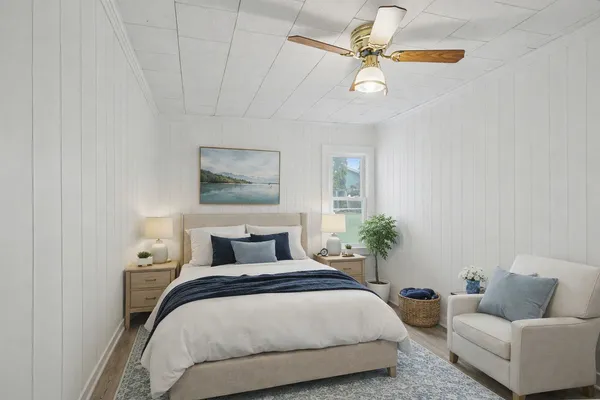 a bedroom with bed and a couch