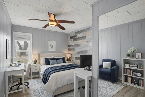 a bedroom with furniture and a fireplace