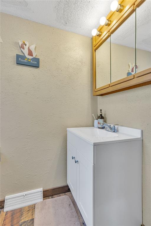6437 Tuscarawas Road Midland, PA 15059 - Photo 16 of 29 a bathroom with a sink and a mirror