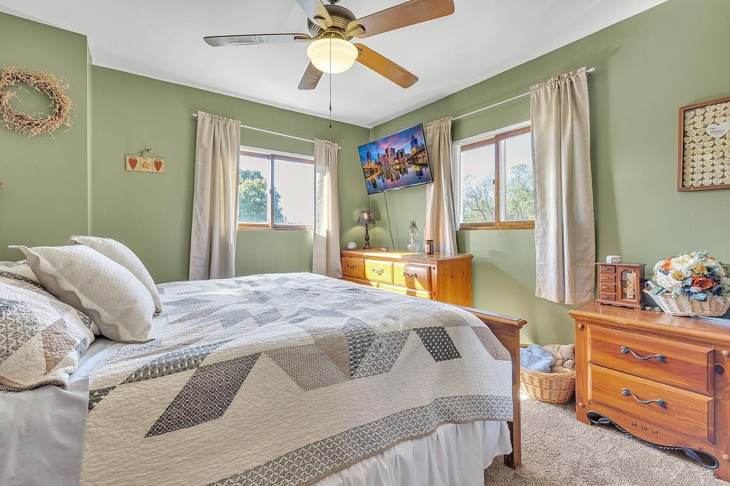 6437 Tuscarawas Road Midland, PA 15059 - Photo 17 of 29 a bedroom with a bed and wooden floor