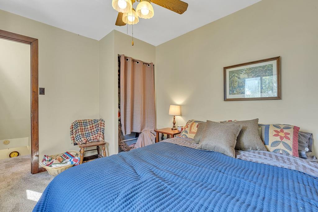 6437 Tuscarawas Road Midland, PA 15059 - Photo 21 of 29 a bedroom with a bed and wooden floor