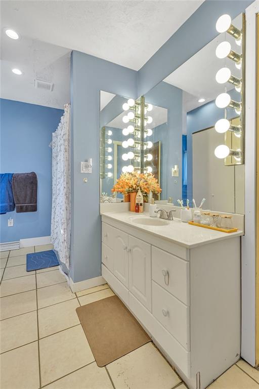 6437 Tuscarawas Road Midland, PA 15059 - Photo 22 of 29 a bathroom with a double vanity sink and a mirror