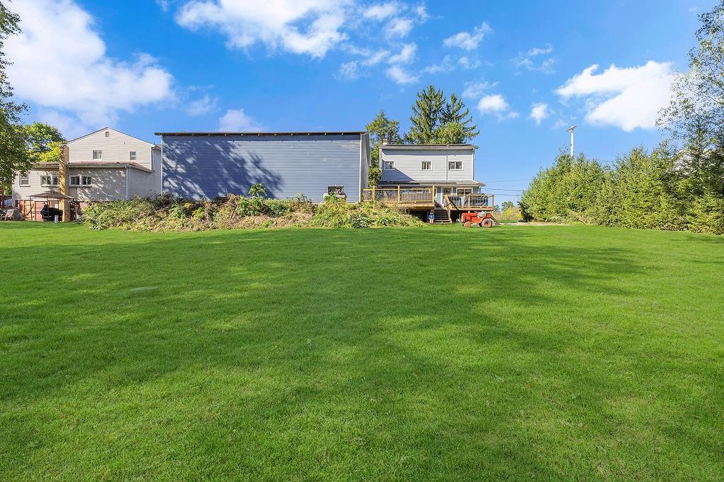 6437 Tuscarawas Road Midland, PA 15059 - Photo 25 of 29 a view of a big yard with a house