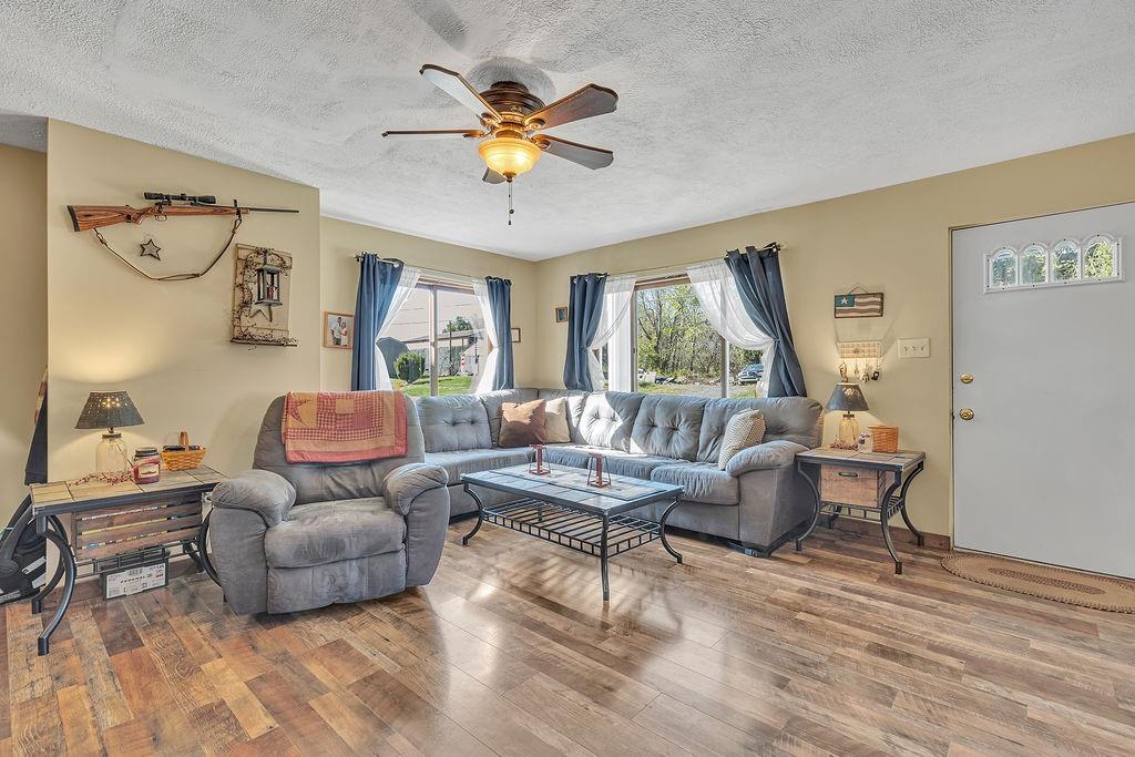 6437 Tuscarawas Road Midland, PA 15059 - Photo 4 of 29 a living room with furniture and a large window