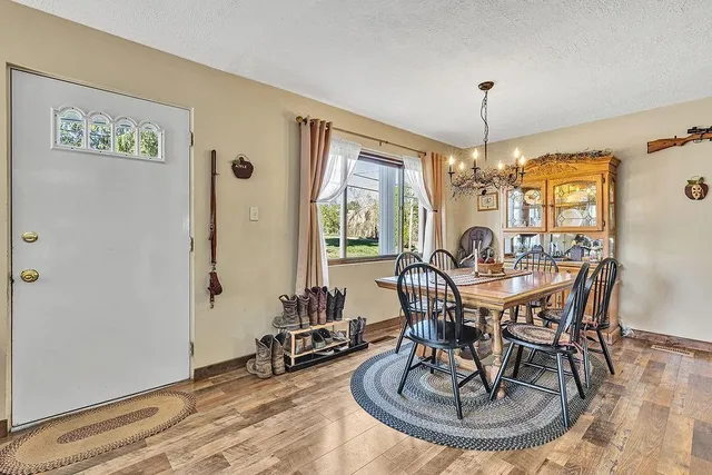 a view of a dining room with furniture window and outside view