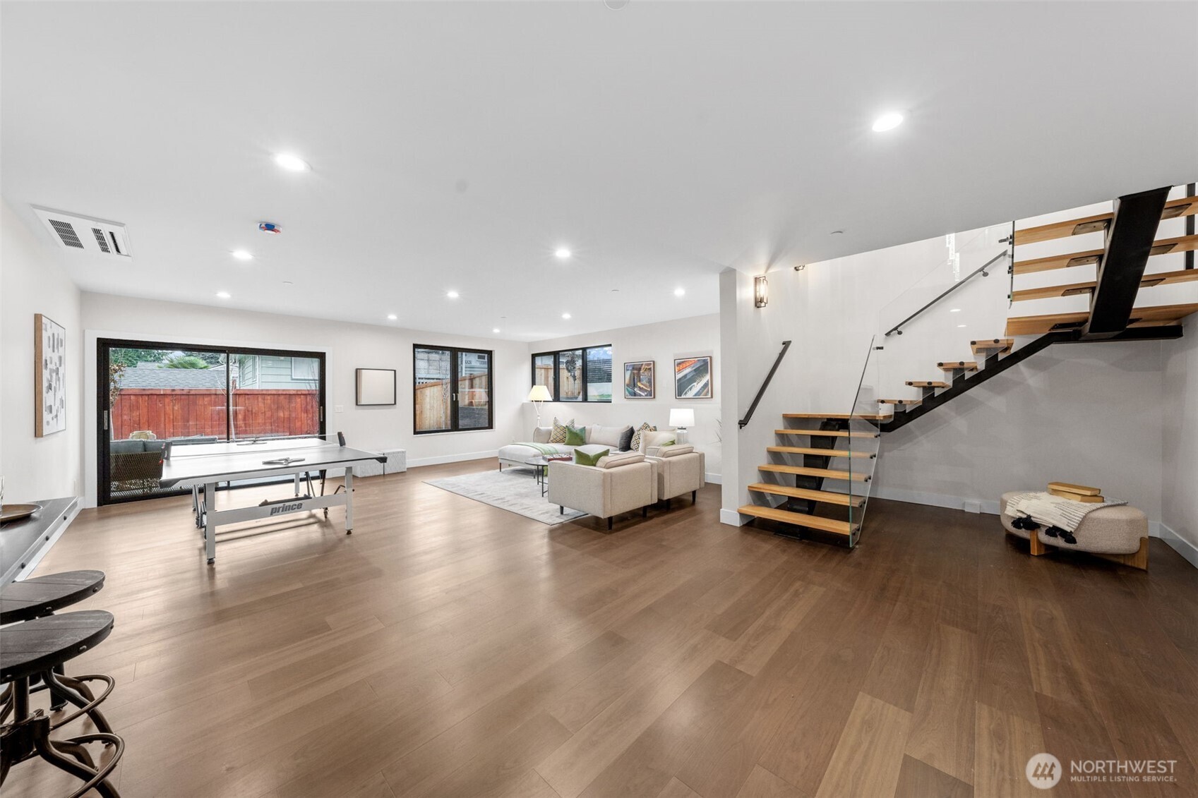 7901 240th Street Southwest Edmonds, WA 98026 - Photo 27 of 37 a living room with furniture and stairs with wooden floor