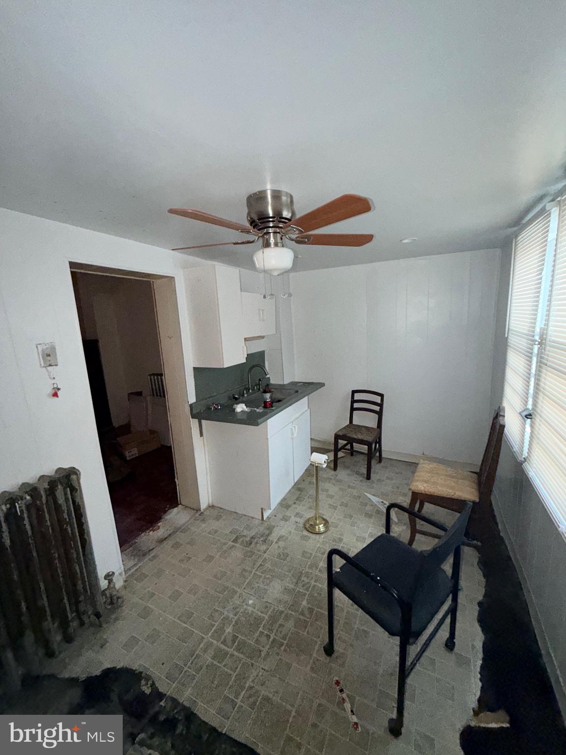 2740 West Cabot Street Philadelphia, PA 19121 - Photo 4 of 7 a workspace with furniture and a window