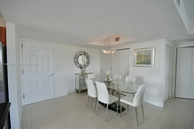a view of a dining room with furniture and window