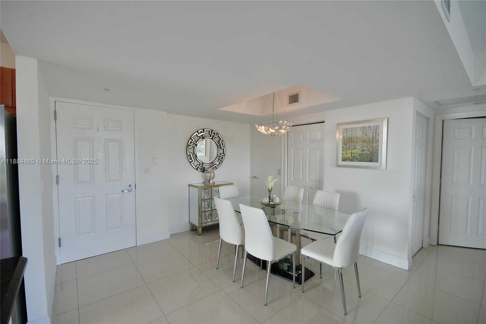3232 Southwest 22nd Terrace, Unit 1502 Miami, FL 33145 - Photo 21 of 45 a view of a dining room with furniture and window