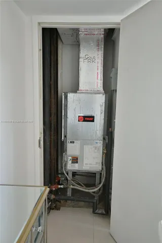 a bedroom with a bed and chair