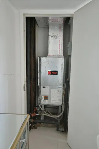 a bedroom with a bed and chair