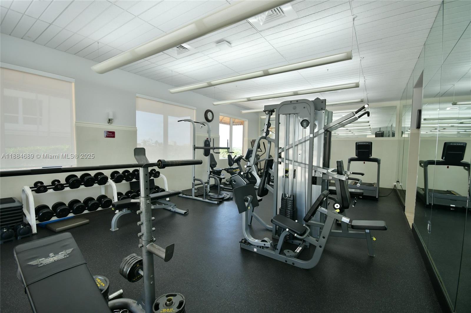 3232 Southwest 22nd Terrace, Unit 1502 Miami, FL 33145 - Photo 38 of 45 a view of a room with gym equipment