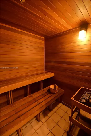 a dining room with furniture window and wooden floor
