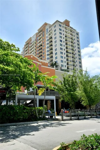a large building with a tree in front of it