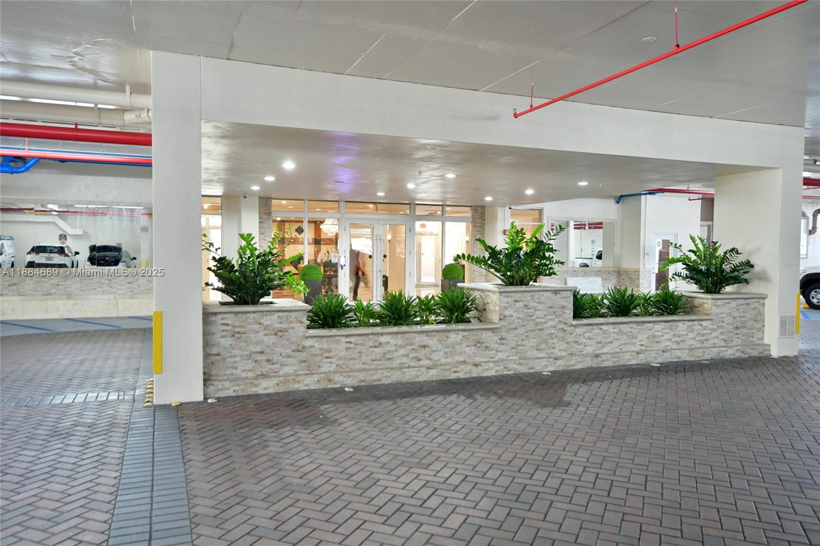 3232 Southwest 22nd Terrace, Unit 1502 Miami, FL 33145 - Photo 9 of 45 a view of a lobby with a potted plant