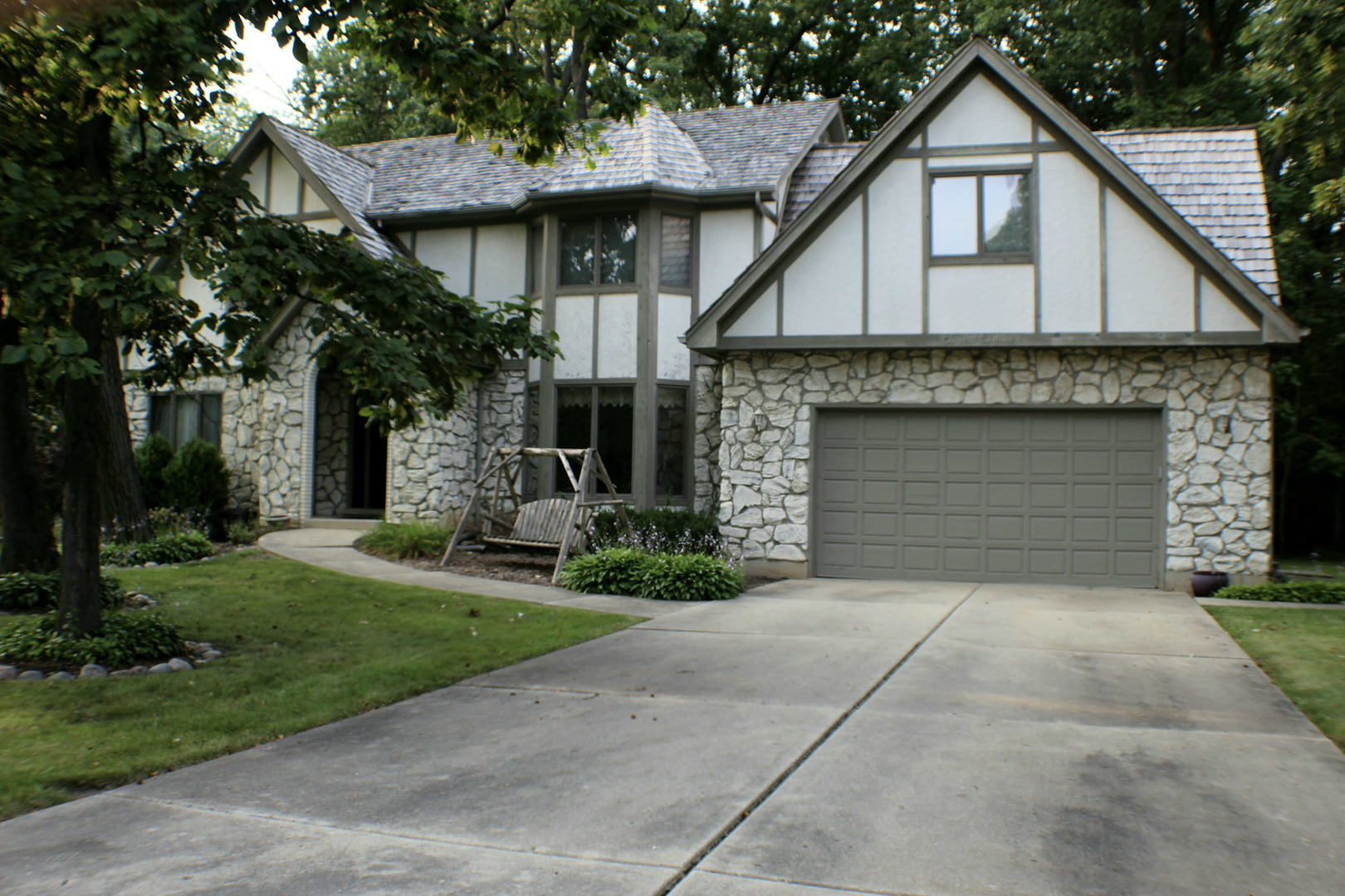 1118 Preserve Trail Bartlett, IL 60103 - Photo 1 of 1 a front view of a house with a garden and garage