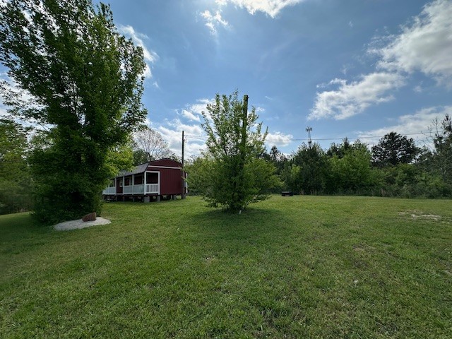 0 Stones Road Camden, TN 38320 - Photo 12 of 28 a view of a big yard with a house
