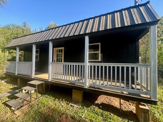 0 Stones Road Camden, TN 38320 - Photo 7 of 28 a view of a house with a wooden deck