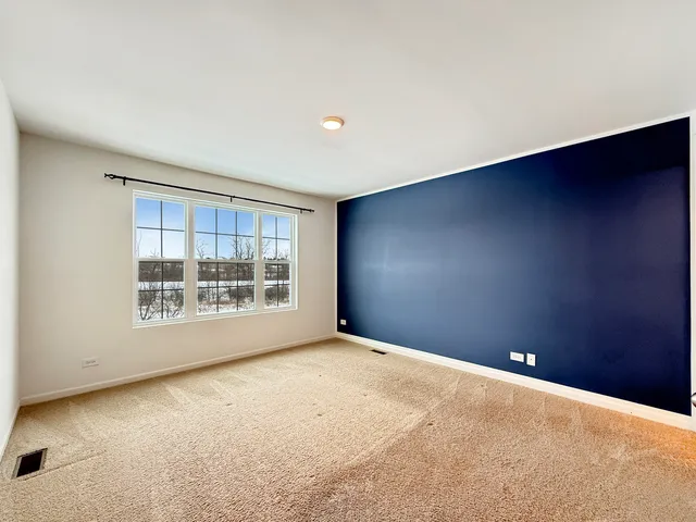 a bathroom with a double vanity sink mirror and toilet