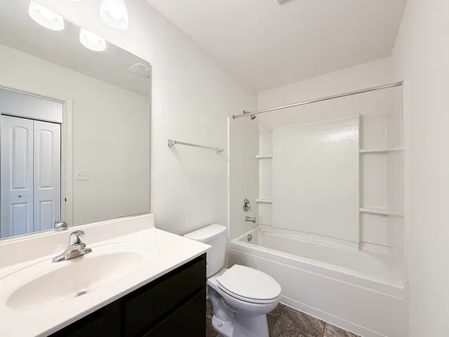 a bedroom with a bed and a cabinets